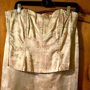 Champagne colored boustier top and skirt with raw edge